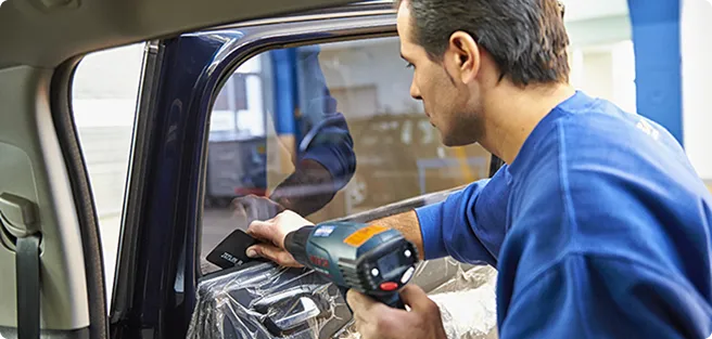Man fixing a car window